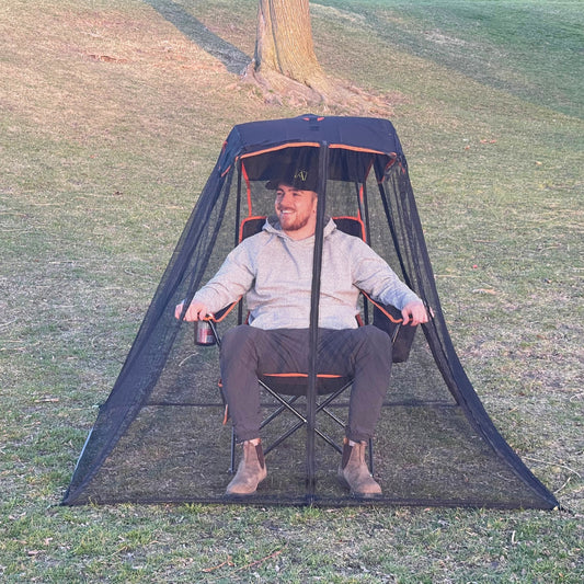 A person enjoying a bug-free outdoor experience while protected under the Bug Beater 2.0.